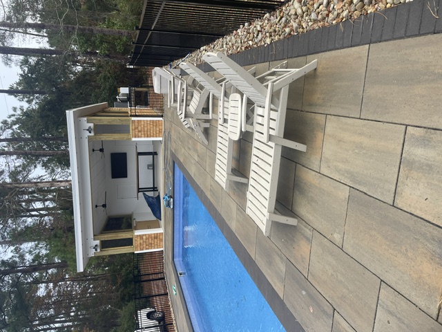 Pool with covered outdoor living pavilion
